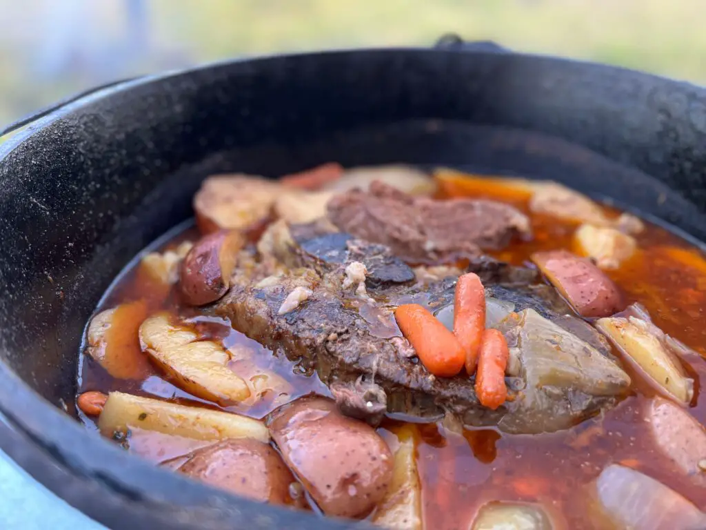 A pot of stew with meat and vegetables in it.