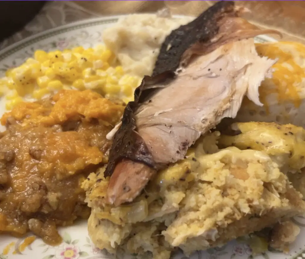 A plate of food with meat and rice.