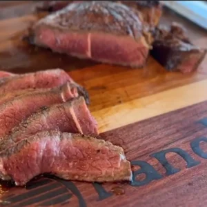 A close up of some meat on a cutting board