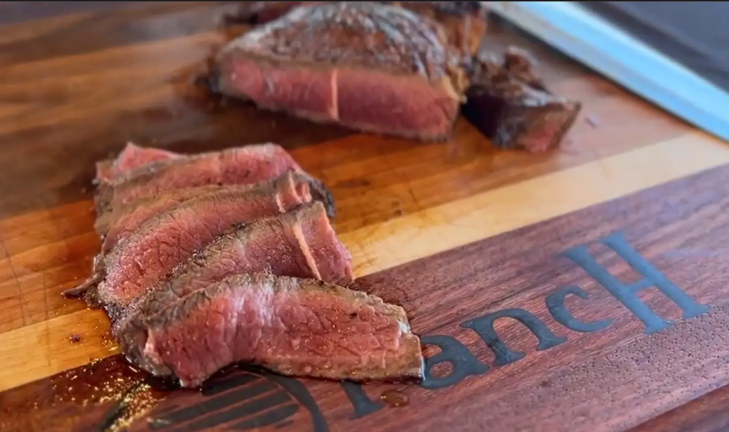 A close up of some meat on a cutting board