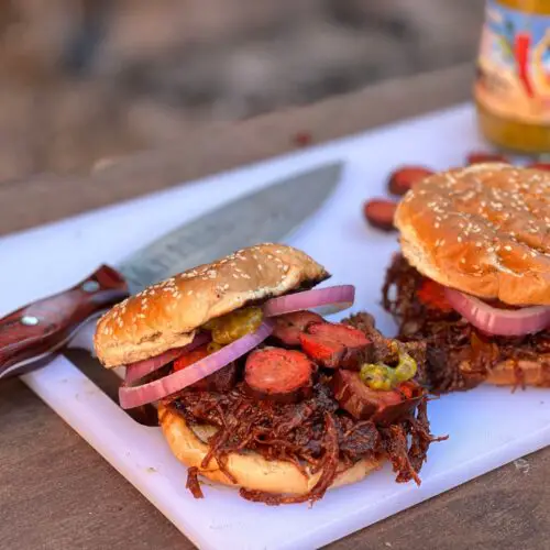 Kent Rollins' Diablo Sandwich. Brisket, hot links, red onion, tangy mustard on a toasted sesame seed bun.