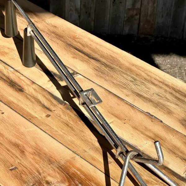 Metal roasting rack on wooden table.