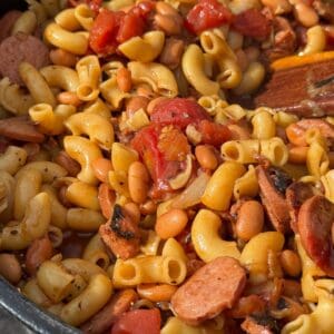 Macaroni and beans with sausage and tomatoes.