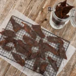 A tray of beef jerky on top of a table.