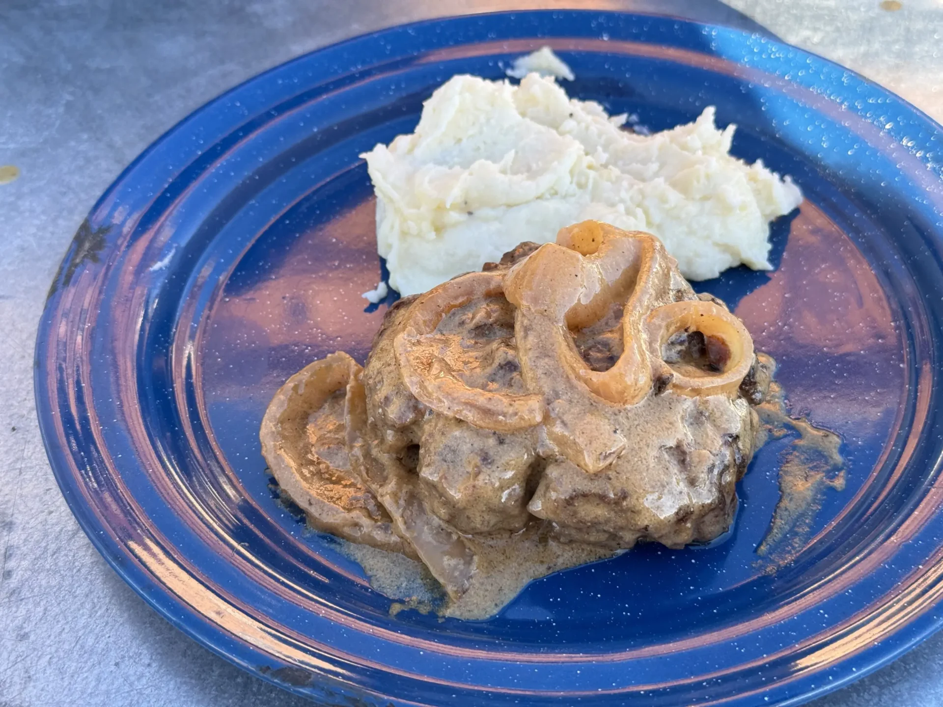 A blue plate with some food on it