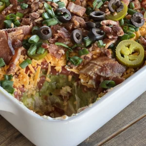 A casserole dish with meat, cheese and vegetables.