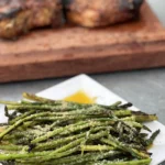 A plate of asparagus on top of a table.