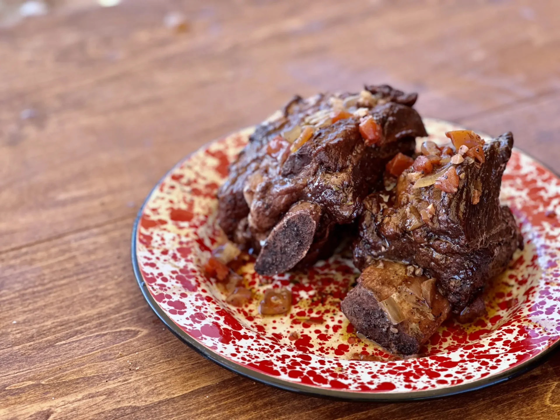 A plate of food on top of a wooden table.