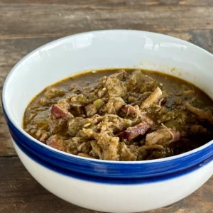 A bowl of stew with meat and vegetables.