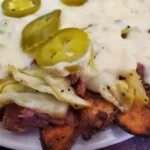 A plate of food with meat and vegetables on it.