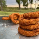 A close up of some fried food on the ground