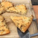 A cutting board with some food on it