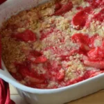 A casserole dish with some strawberries in it