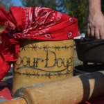 A close up of a pot with a bandanna on it