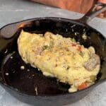 A cast iron skillet with some food in it
