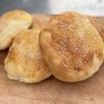 A close up of some bread on a wooden board