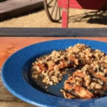 A blue plate with some food on top of it