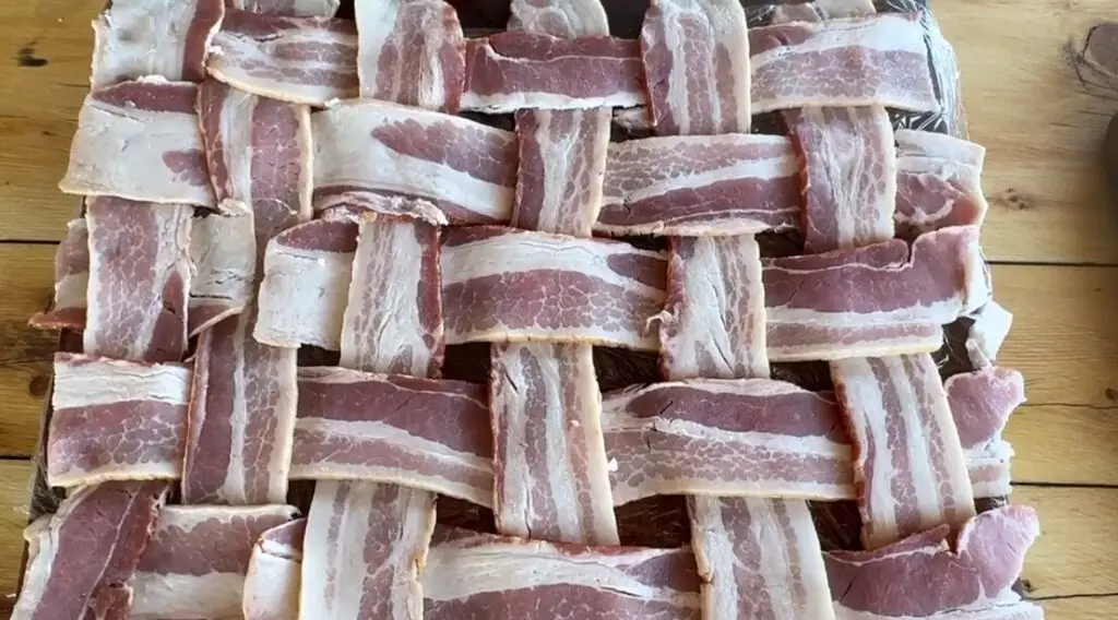 11 slices of bacon weaved together like a basket. Six slices of the bottom with five slices over and under sideways. 