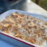 A white tray with some food on top of it