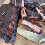 A close up of some meat on a cutting board