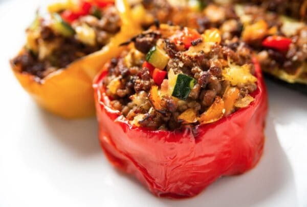 Stuffed red bell pepper with meat and vegetables.