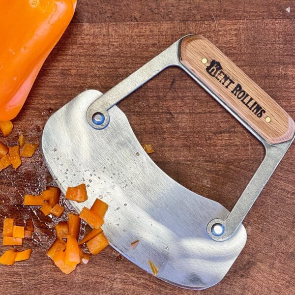 Bent Rollins chopping knife with peppers.