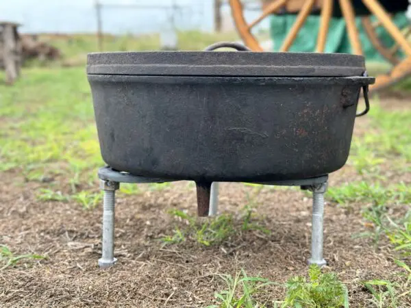 Black cast iron pot on a stand.