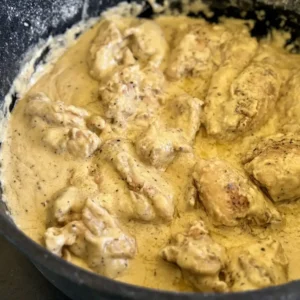 Chicken in creamy sauce, skillet.