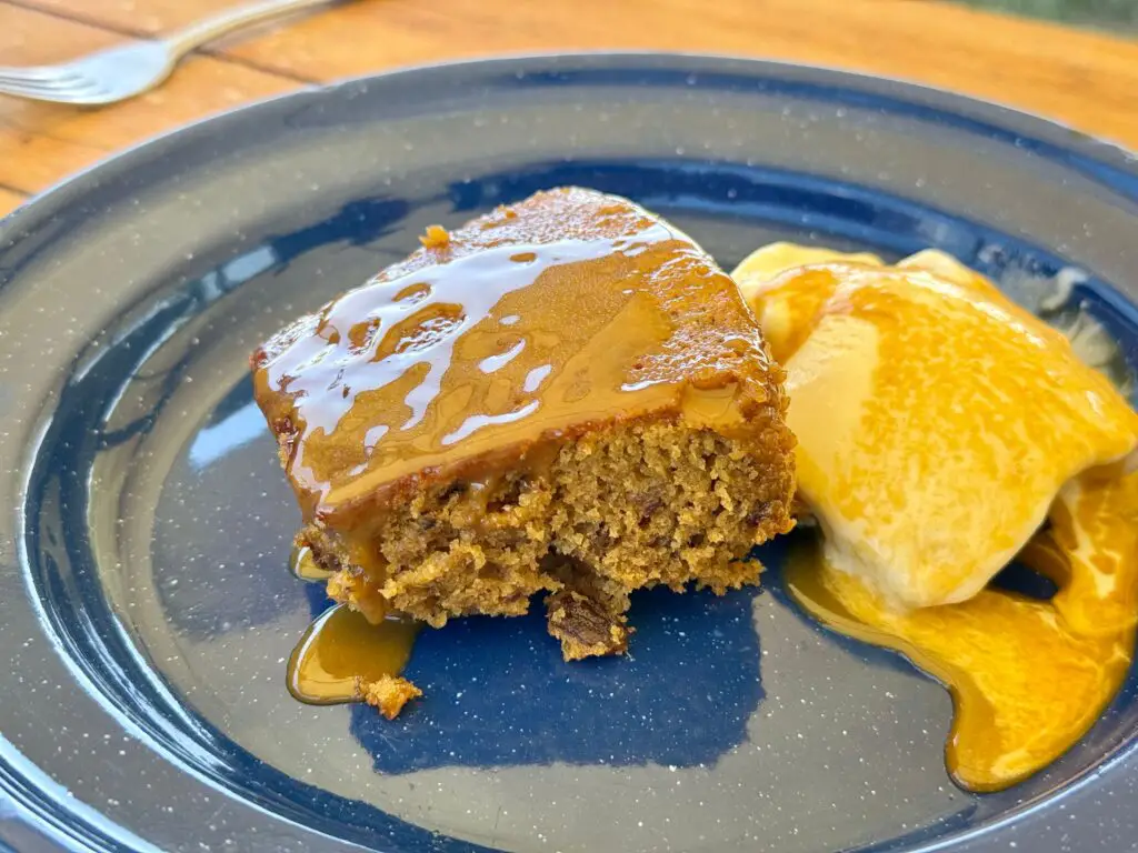 Sticky toffee pudding with caramel sauce and ice cream.