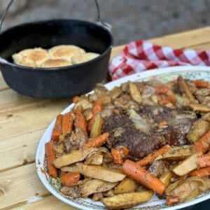 Roast beef dinner with potatoes and carrots.