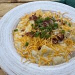 Loaded cheesy potatoes with bacon.