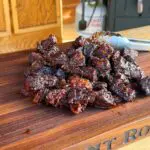 Cowboy Kent Rollins' Poor Mans Burnt Ends on a wooden cutting board