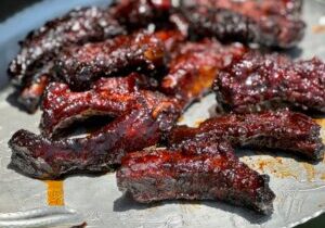 Delicious party ribs covered in caramelized custom sauce by Kent Rollins
